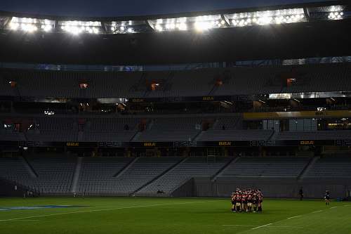 eden park group of football players on green grass field new zealand